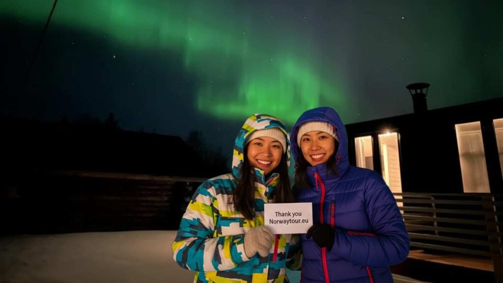 Nancie and Doreen enjoying their Norway tour from Singapore, posing under the northern lights. They are also thanking norwaytour.eu for planning and organizing their trip. 